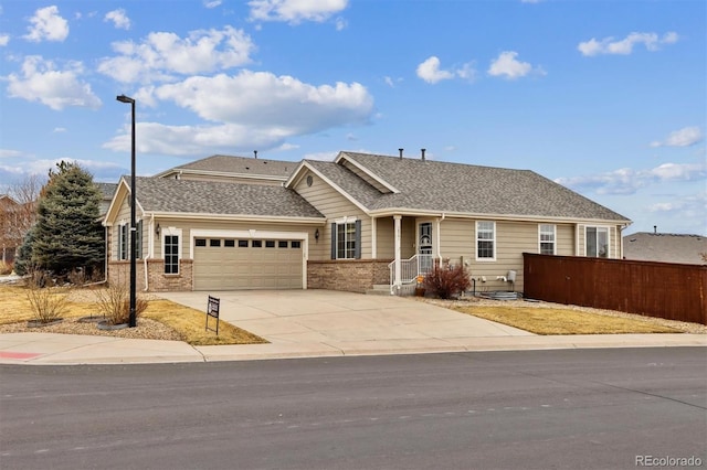 single story home with a garage, brick siding, fence, concrete driveway, and roof with shingles