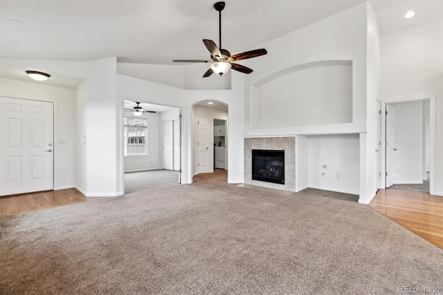 unfurnished living room with recessed lighting, a fireplace, carpet flooring, a ceiling fan, and baseboards