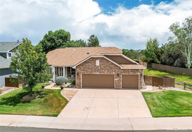 10292 Nickolas Ave, Highlands Ranch, CO 80130 - view of front of house with a garage, driveway, stone siding, and roof with shingles