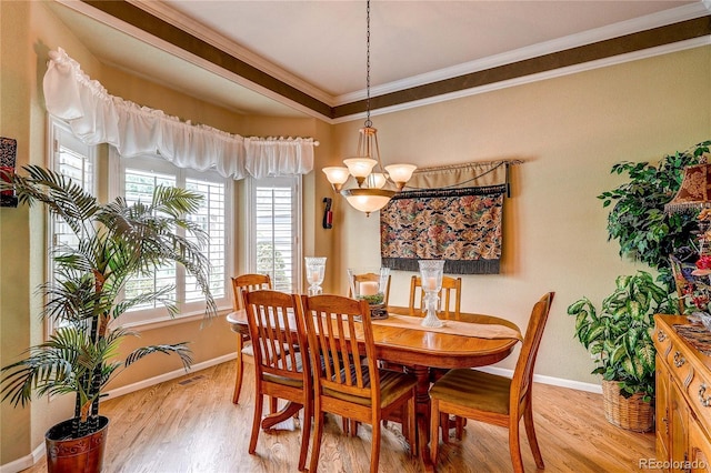 10292 Nickolas Ave, Highlands Ranch, CO 80130 - dining room featuring crown molding and light wood finished floors
