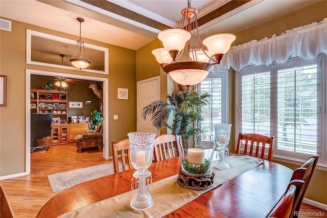 10292 Nickolas Ave, Highlands Ranch, CO 80130 - dining space featuring wood finished floors, crown molding, and ceiling fan