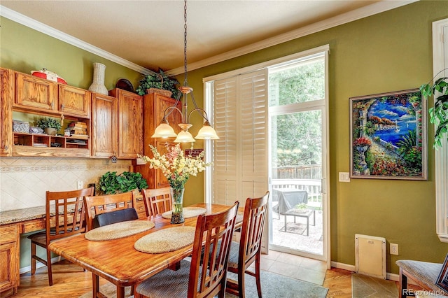 10292 Nickolas Ave, Highlands Ranch, CO 80130 - dining space featuring ornamental molding and light tile patterned floors