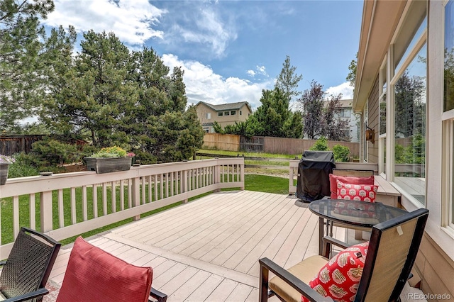 10292 Nickolas Ave, Highlands Ranch, CO 80130 - deck featuring a fenced backyard, grilling area, and outdoor dining space