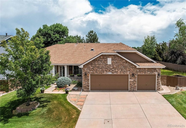 10292 Nickolas Ave, Highlands Ranch, CO 80130 - view of front of property with driveway, stone siding, an attached garage, and roof with shingles