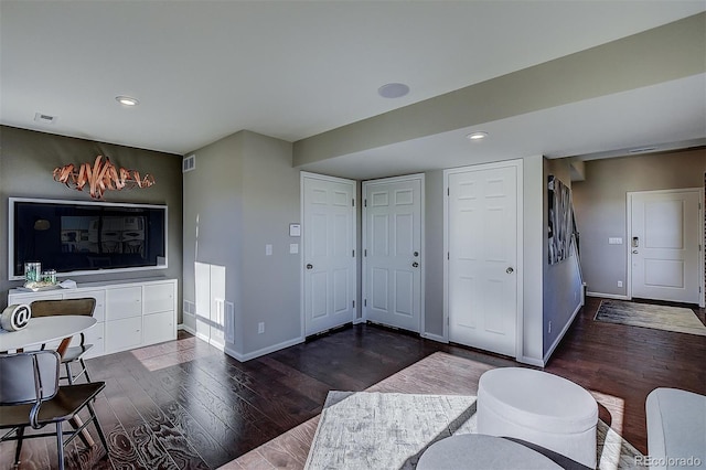 living room with dark wood-type flooring