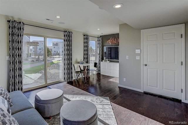 living room featuring dark hardwood / wood-style flooring