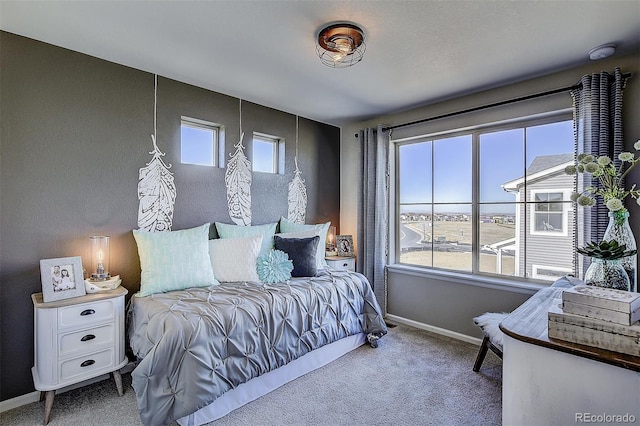 bedroom featuring carpet floors and multiple windows