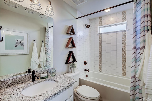 full bathroom featuring toilet, shower / bath combo, and vanity