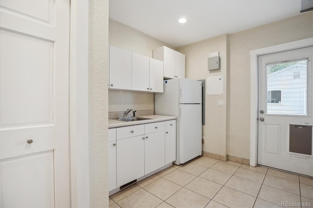 1526 S Gaylord St, Denver, CO 80210 - kitchen featuring a sink, light countertops, freestanding refrigerator, white cabinets, and recessed lighting