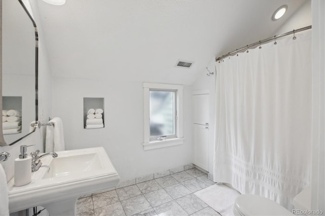 1526 S Gaylord St, Denver, CO 80210 - full bath with vaulted ceiling, toilet, curtained shower, and a sink