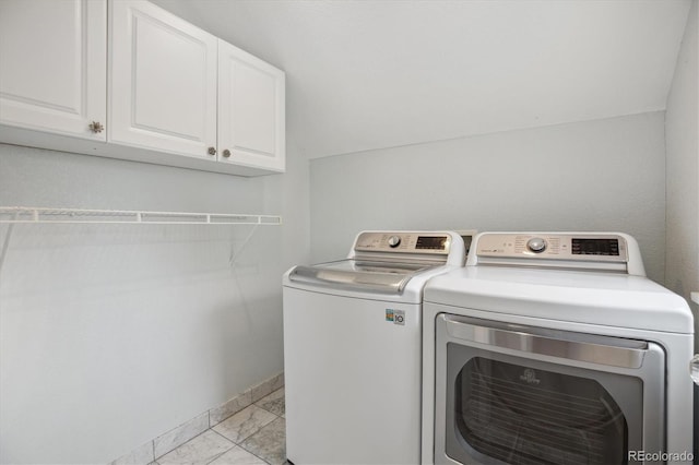 1526 S Gaylord St, Denver, CO 80210 - washroom featuring light marble finish flooring, cabinet space, independent washer and dryer, and baseboards