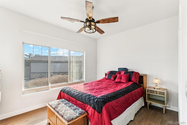 bedroom featuring hardwood / wood-style flooring and ceiling fan