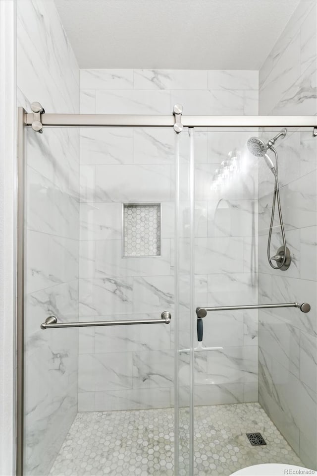 bathroom with an enclosed shower