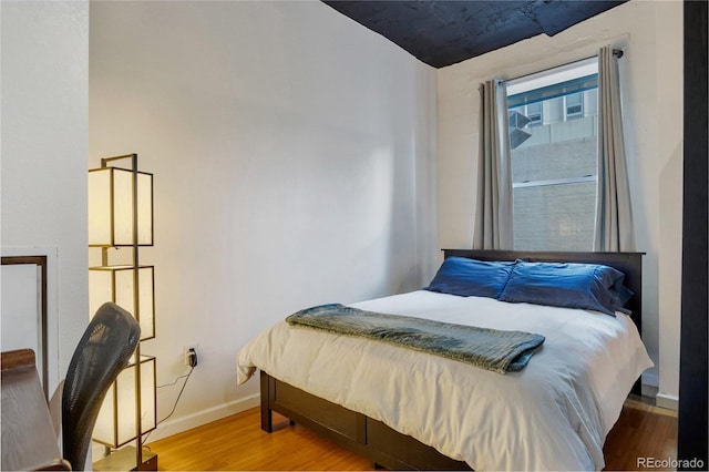 bedroom featuring hardwood / wood-style flooring