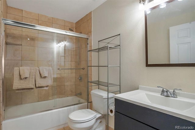 full bathroom with shower / bath combination with glass door, vanity, and toilet