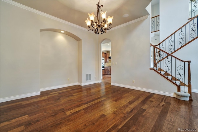 interior space with stairs, a notable chandelier, baseboards, and wood finished floors