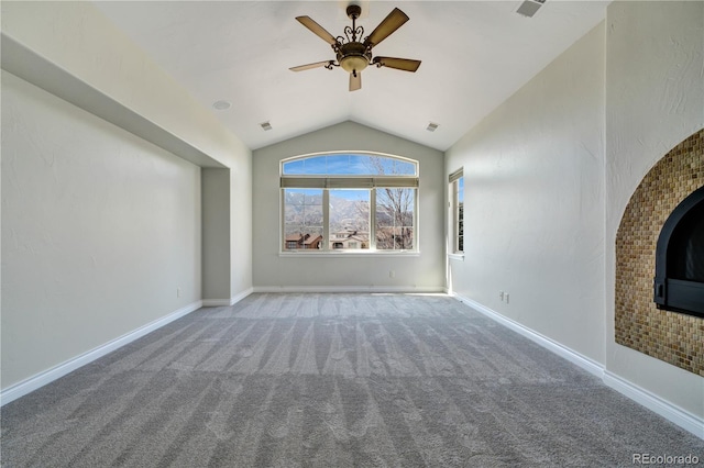 unfurnished living room with carpet floors, lofted ceiling, visible vents, a ceiling fan, and baseboards