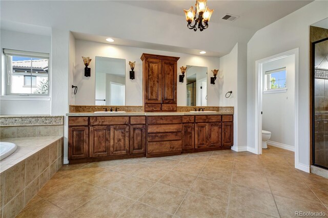 bathroom with plenty of natural light, visible vents, and a sink