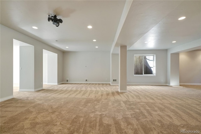 interior space with light carpet, baseboards, and recessed lighting