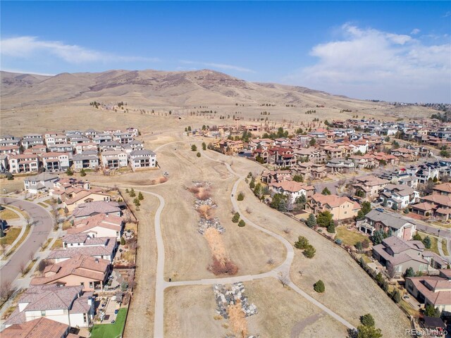 birds eye view of property with a residential view and a mountain view