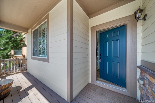 doorway to property with a porch