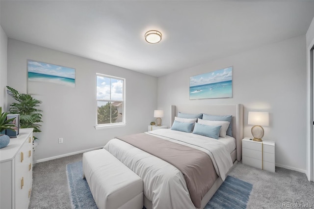 bedroom with baseboards and light carpet