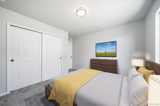 bedroom featuring a closet and dark carpet