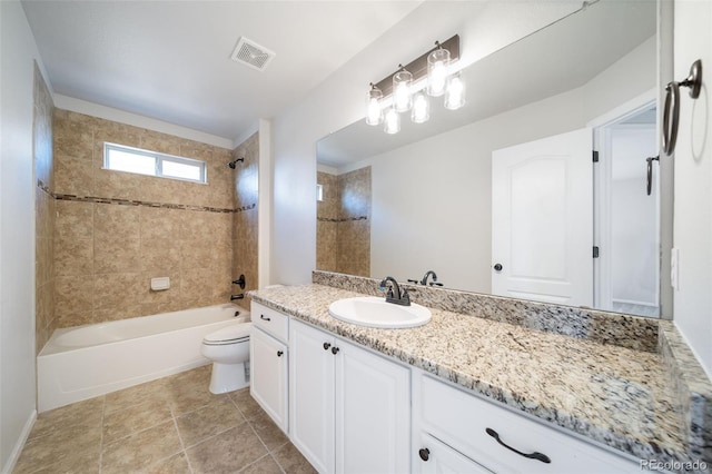 full bath featuring visible vents, tile patterned flooring, vanity, toilet, and washtub / shower combination