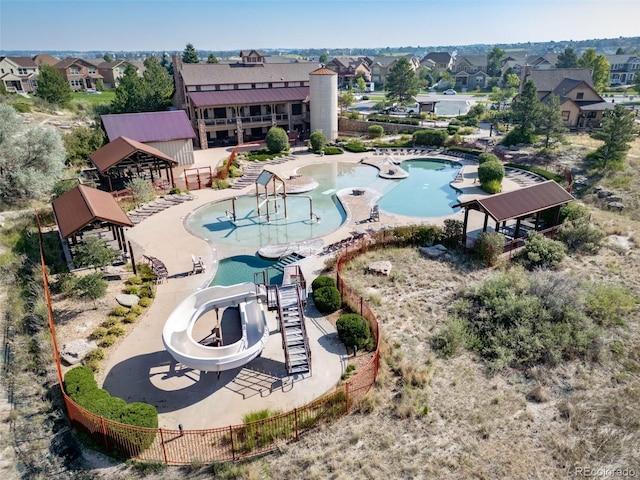 view of pool with a residential view