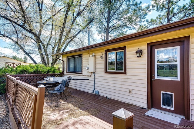 wooden deck with outdoor dining area