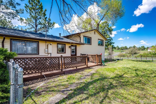 back of house with a wooden deck