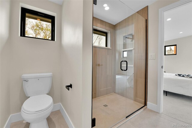 2164 S Ash St, Denver, CO 80222 - ensuite bathroom with baseboards, a stall shower, toilet, and recessed lighting