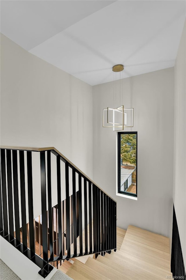 2164 S Ash St, Denver, CO 80222 - stairway with a chandelier and wood finished floors