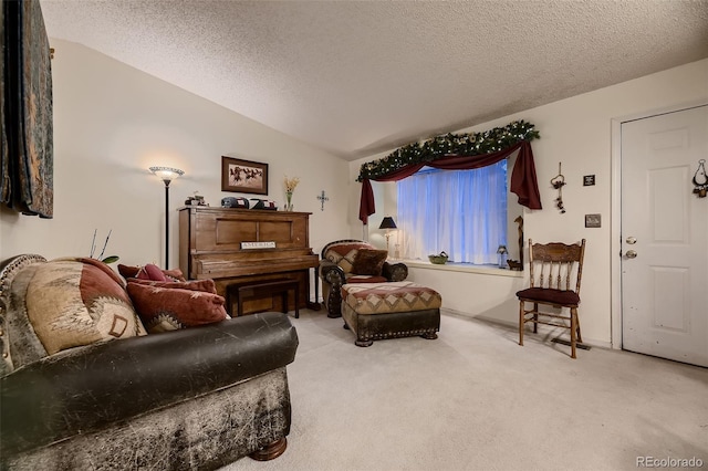 carpeted living room featuring vaulted ceiling and a textured ceiling