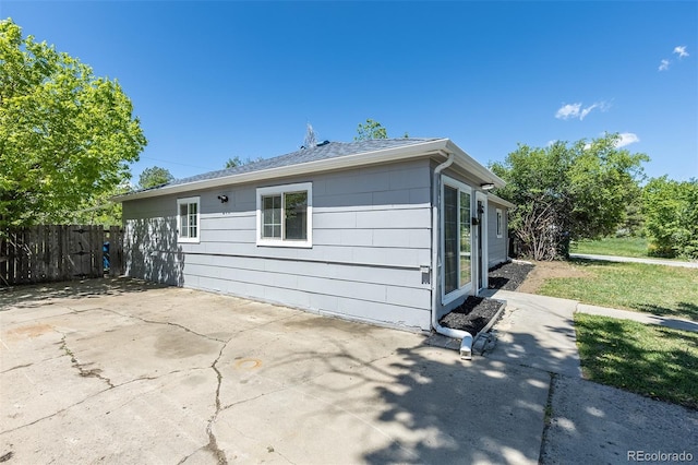 967 Victor St, Aurora, CO 80011 - view of side of home featuring a patio area