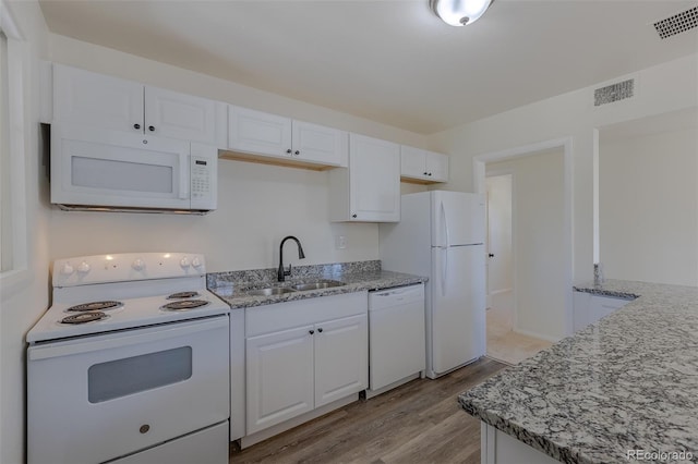 967 Victor St, Aurora, CO 80011 - kitchen featuring white appliances, a sink, white cabinets, and light wood finished floors
