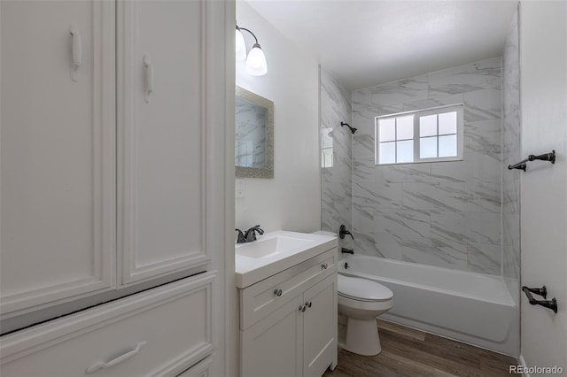 967 Victor St, Aurora, CO 80011 - bathroom featuring toilet, vanity, bathing tub / shower combination, and wood finished floors