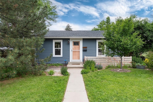 3175 S Pennsylvania St, Englewood, CO 80113 - view of front facade with a front lawn and a shingled roof