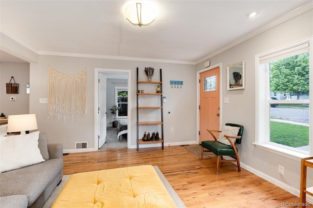 3175 S Pennsylvania St, Englewood, CO 80113 - living area featuring light wood-style floors, ornamental molding, and baseboards