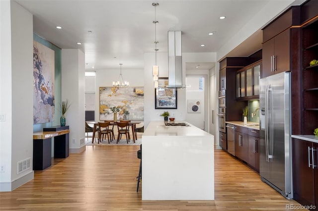 kitchen with open shelves, stainless steel appliances, light countertops, visible vents, and light wood-style floors