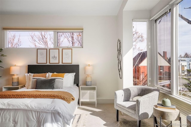 bedroom with carpet and baseboards