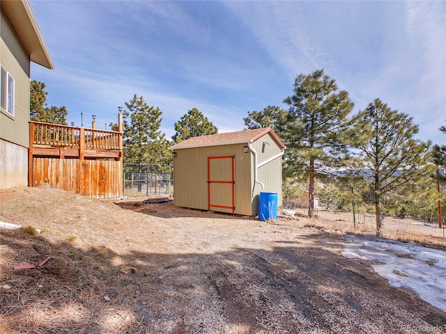 view of shed with fence