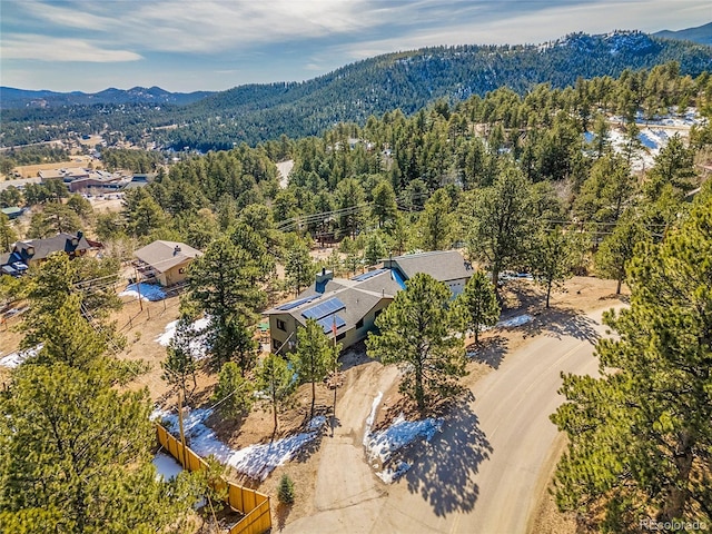 bird's eye view with a forest view and a mountain view