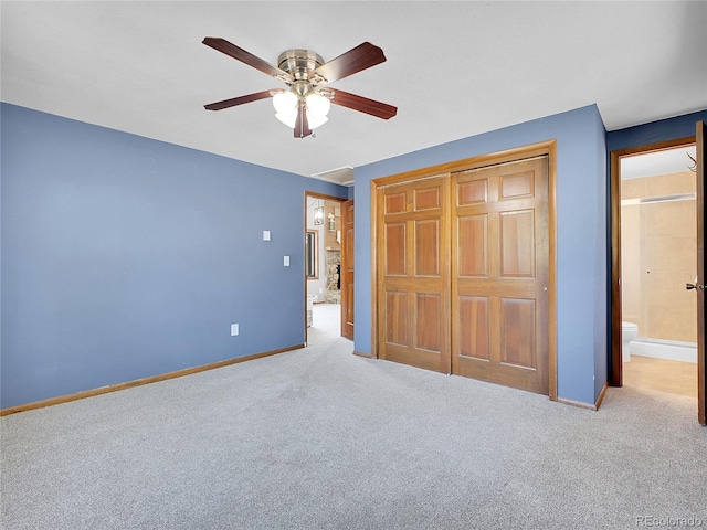 unfurnished bedroom featuring a closet, baseboards, a ceiling fan, and carpet flooring