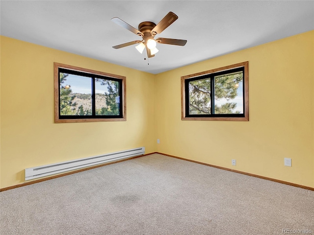 carpeted empty room featuring a baseboard radiator, baseboards, a healthy amount of sunlight, and a ceiling fan