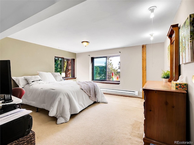 bedroom with light carpet and baseboard heating