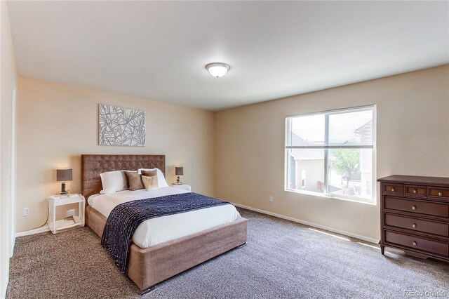 5549 Helena St, Denver, CO 80239 - carpeted bedroom featuring baseboards