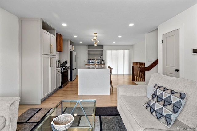 690 S Newark Ct, Aurora, CO 80012 - living room featuring recessed lighting and light wood-style floors