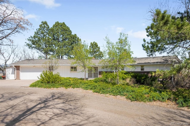 12940 W 75th Ave, Arvada, CO 80005 - ranch-style home with driveway, a garage, and brick siding