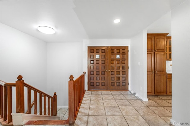 12940 W 75th Ave, Arvada, CO 80005 - entrance foyer featuring baseboards and light tile patterned floors